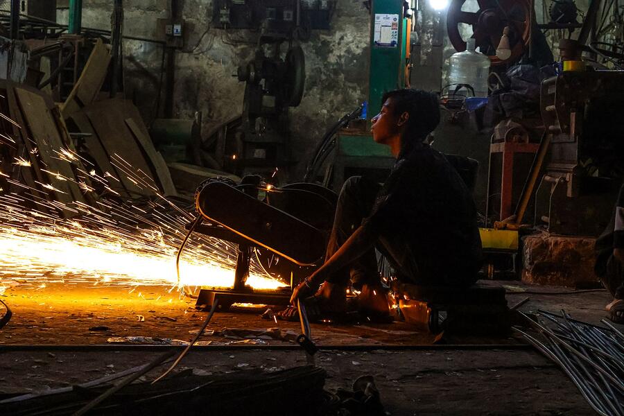 A welding arc lighting a dark work area